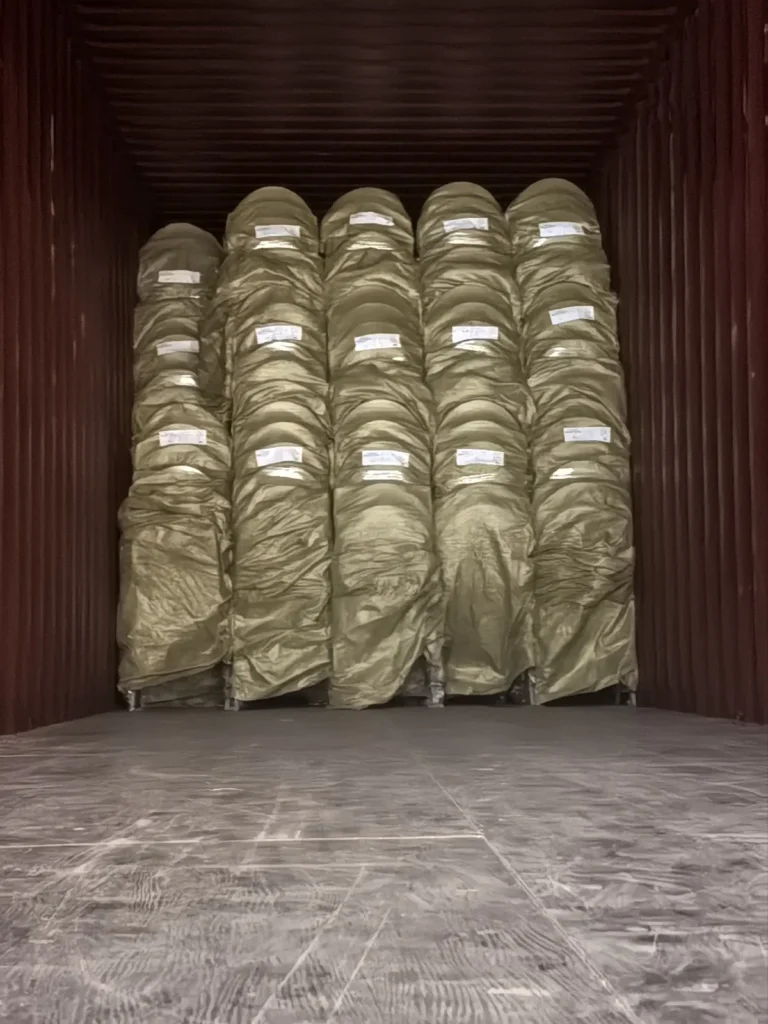 Banquet chairs stacked and wrapped for container shipping