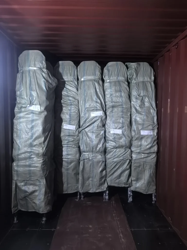 Wrapped banquet chair stacks secured inside a container